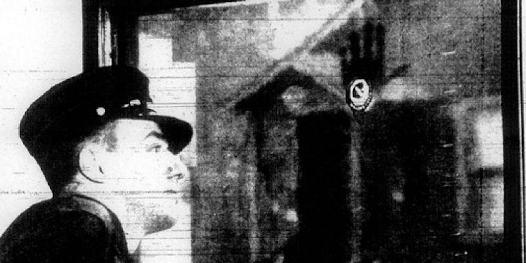Irremovable handprint of Francis Leavy on the Chicago Fire Department window.